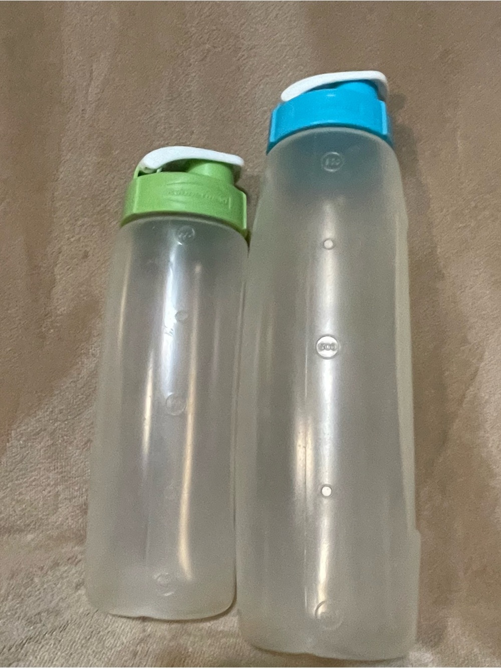 Tupperware Set of Clear Storage Bottles with Green and Blue Lids